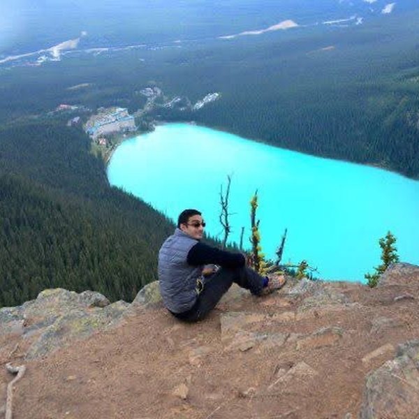Sitting on a ledge high above Lake Louise